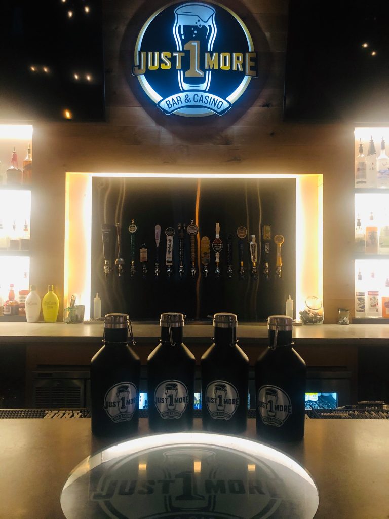 Back bar and draft tap wall at Just 1 More Bar and Casino